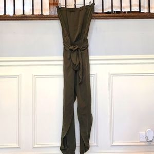 Akira green jumpsuit with open slit pants that tie.